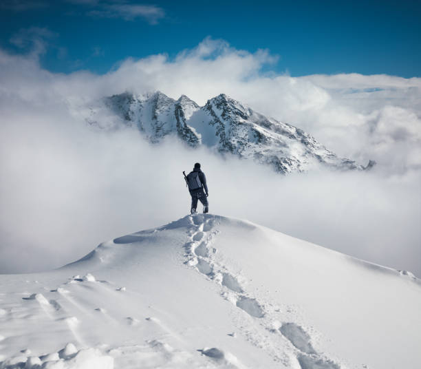A climber ascending a snowy Alpine peak, demonstrating the challenge of the Alpine Ascent package.