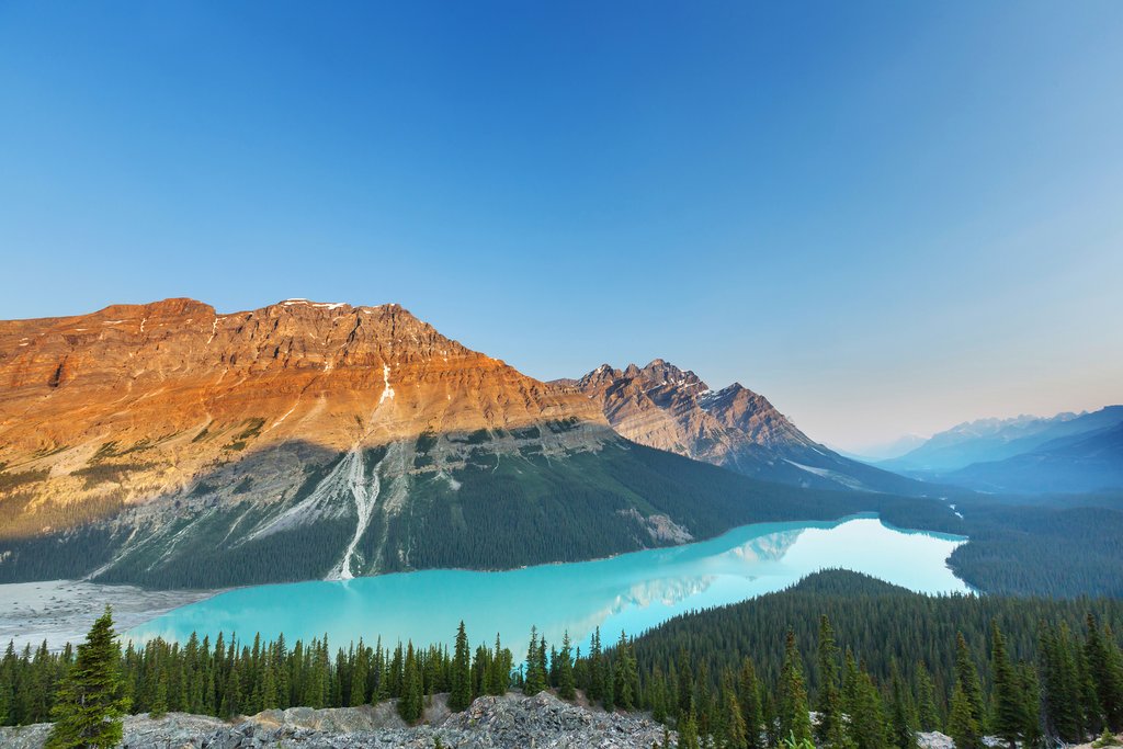 An alpine lake surrounded by the rugged peaks of the Canadian Rockies.